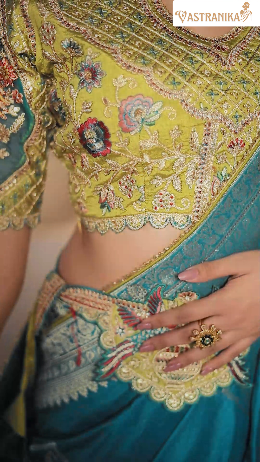 Model draped in a firozi premium silk saree featuring intricate heavy weaving and grand pallu, paired with a designer and contrast blouse – from Vastranika's Weaves collection.