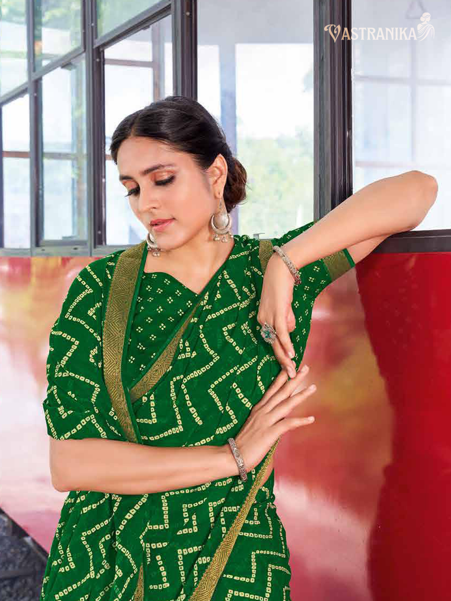 Emerald green moss crepe saree with zig-zag batik leheriya print, zari border, and printed blouse – Vastranika 45032 festive wear

