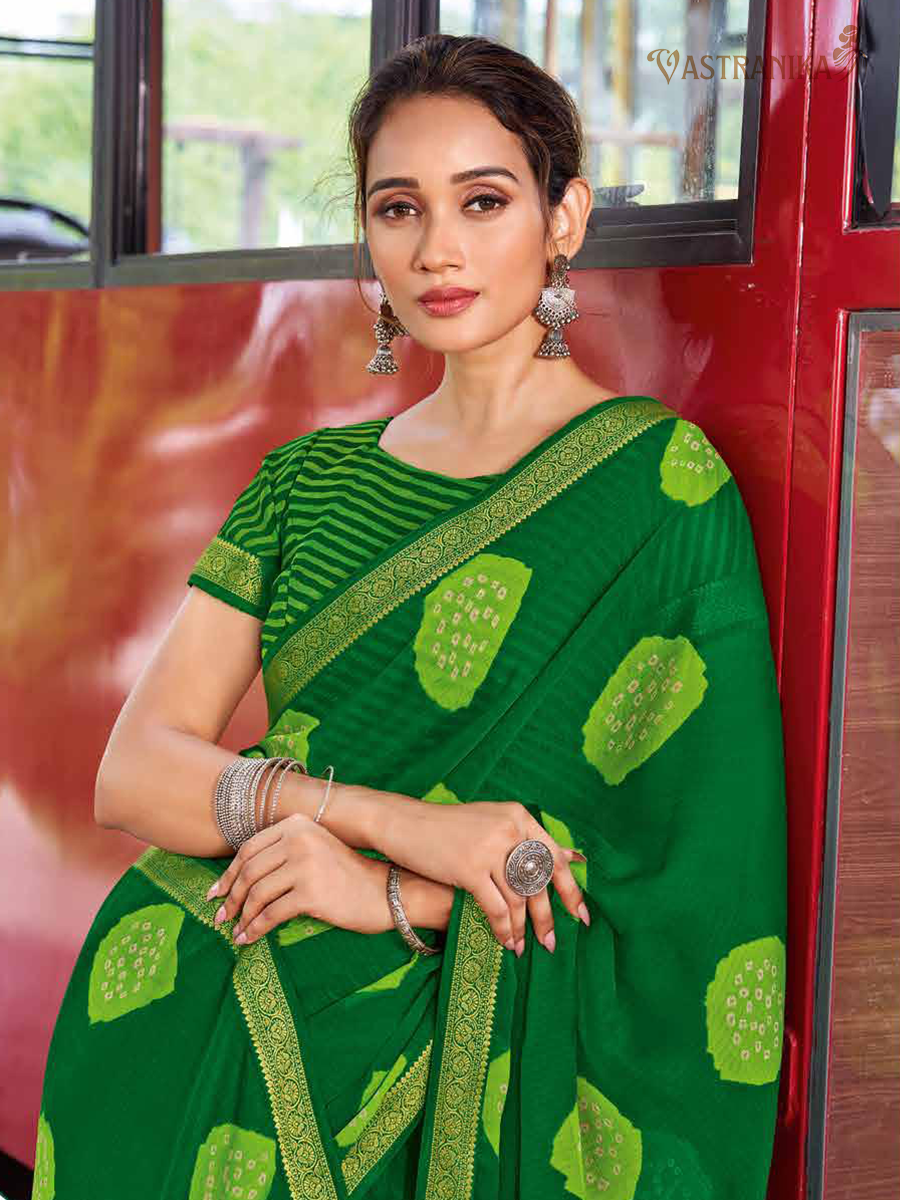 Lush green moss crepe saree with bold stripe and dot patterns, heavy golden zari border, and printed blouse – Vastranika Sawan collection, Design 45037