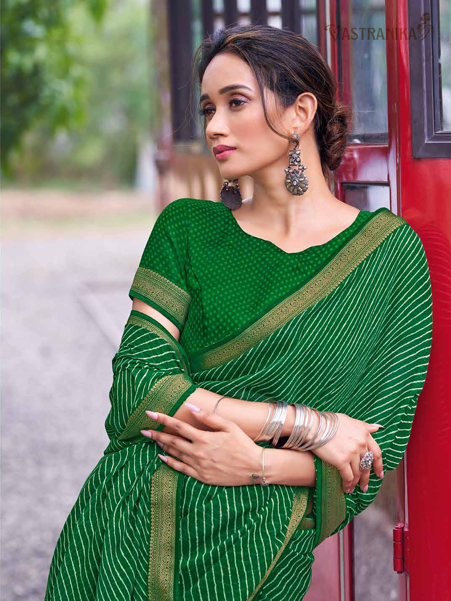 Vibrant green moss crepe saree with bold leheriya print, golden zari border, and matching printed blouse – Vastranika Sawan collection, Design 45046

