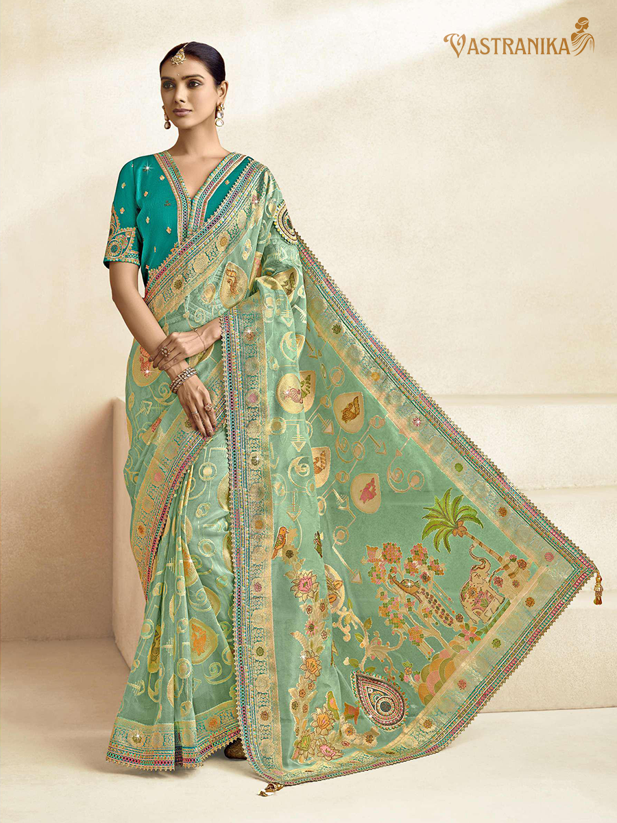 Vastranika Exclusive: Radiant Aqua Green Premium Tissue Silk Saree with Dual Designer Blouses