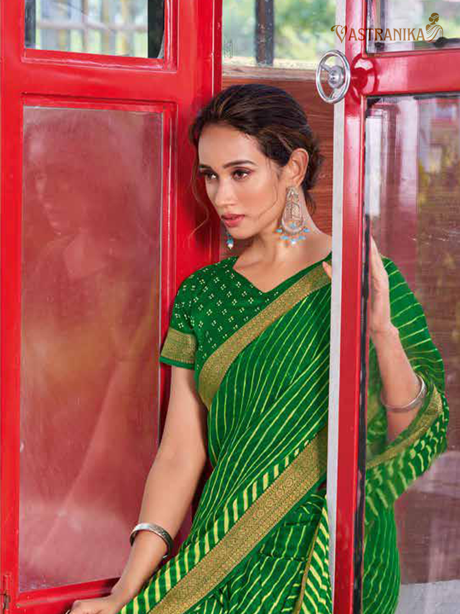 Green moss crepe saree with bold leheriya print, heavy zari border, and printed blouse – Vastranika Sawan festive collection, Design 45039


