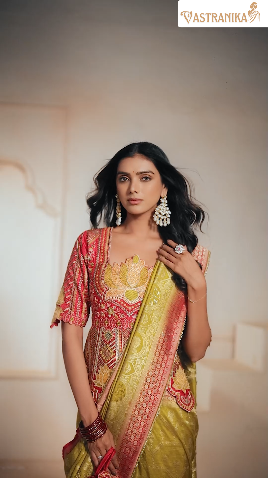 Model wearing olive green premium silk saree with intricate heavy weaving and grand pallu, styled with a contrast designer blouse – from Vastranika's Weaves collection.