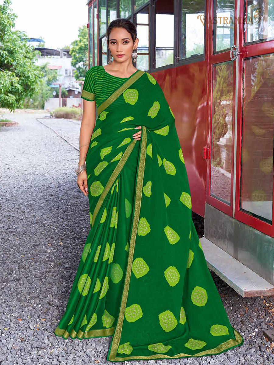 Lush green moss crepe saree with bold stripe and dot patterns, heavy golden zari border, and printed blouse – Vastranika Sawan collection, Design 45037