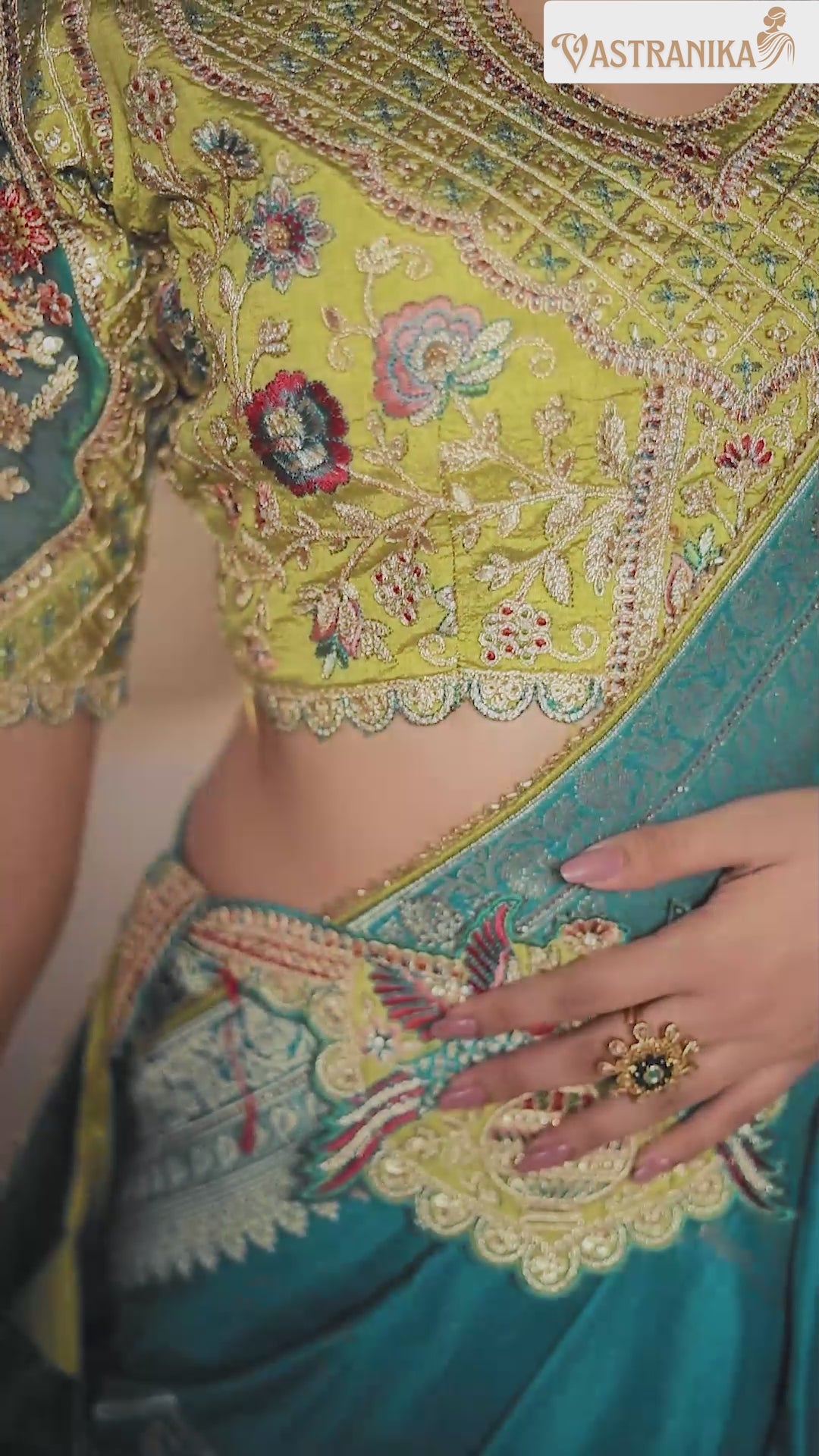 Model draped in a firozi premium silk saree featuring intricate heavy weaving and grand pallu, paired with a designer and contrast blouse – from Vastranika's Weaves collection.