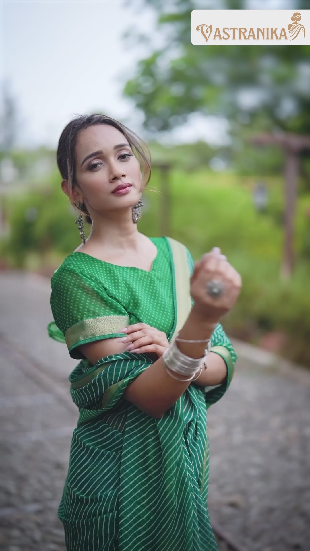 Vibrant green moss crepe saree with bold leheriya print, golden zari border, and matching printed blouse – Vastranika Sawan collection, Design 45046


