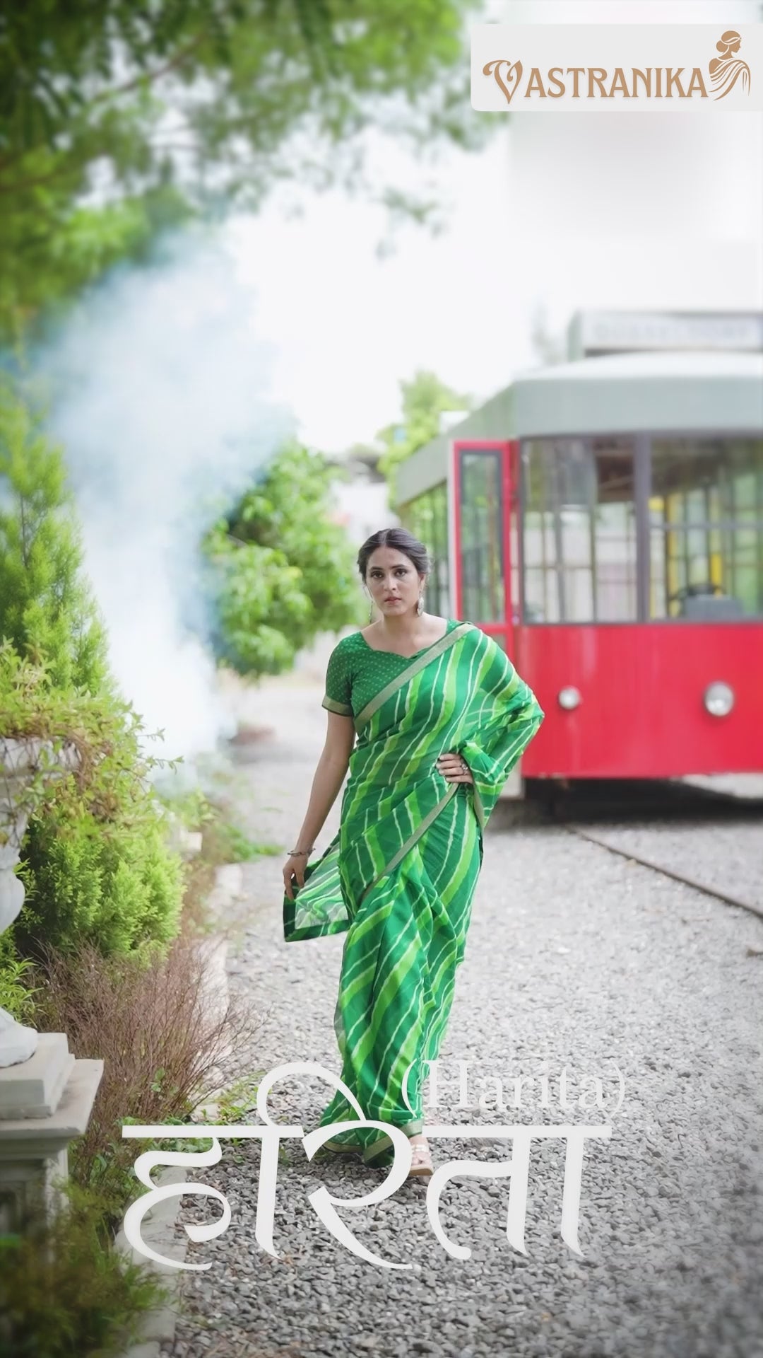 Model wearing a lush green pure moss crepe saree adorned with batik and bandhej prints, paired with a matching printed blouse – from Vastranika Exclusive 45043, ideal for Sawan and festive occasions.

