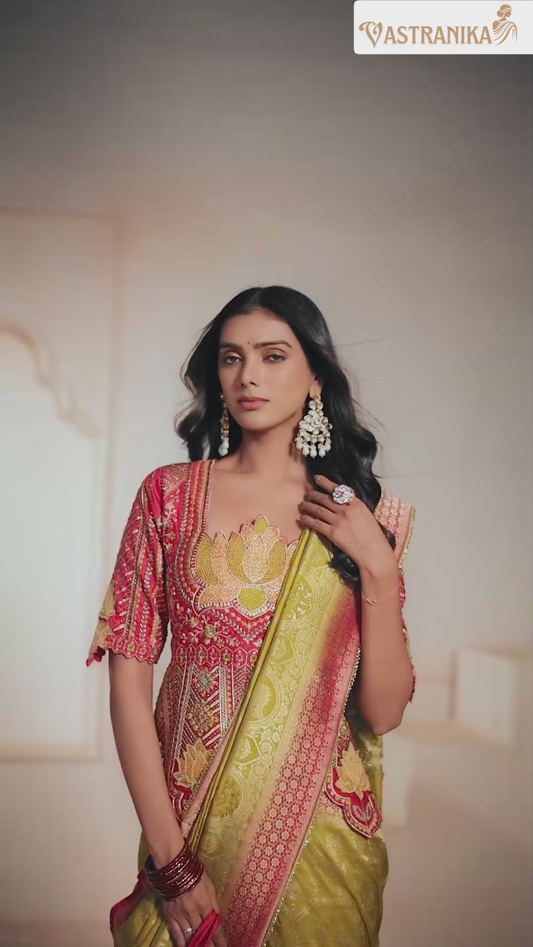 Model wearing olive green premium silk saree with intricate heavy weaving and grand pallu, styled with a contrast designer blouse – from Vastranika's Weaves collection.